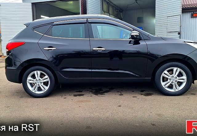 Чорний Хендай іх35, об'ємом двигуна 2 л та пробігом 169 тис. км за 14300 $, фото 4 на Automoto.ua