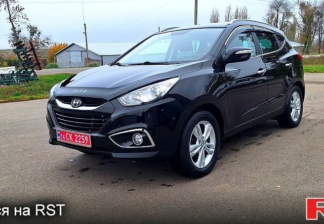 Чорний Хендай іх35, об'ємом двигуна 2 л та пробігом 169 тис. км за 14300 $, фото 2 на Automoto.ua