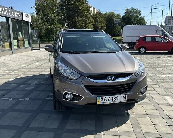 Коричневий Хендай іх35, об'ємом двигуна 2 л та пробігом 164 тис. км за 12500 $, фото 4 на Automoto.ua
