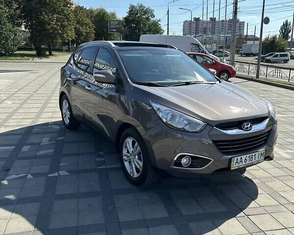 Коричневий Хендай іх35, об'ємом двигуна 2 л та пробігом 164 тис. км за 12500 $, фото 6 на Automoto.ua