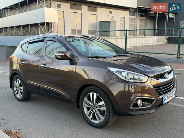 Коричневий Хендай іх35, об'ємом двигуна 2 л та пробігом 176 тис. км за 14500 $, фото 17 на Automoto.ua