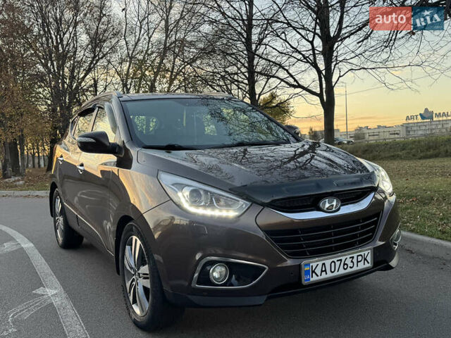 Коричневий Хендай іх35, об'ємом двигуна 2 л та пробігом 176 тис. км за 14500 $, фото 1 на Automoto.ua