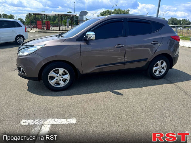 Коричневий Хендай іх35, об'ємом двигуна 1.7 л та пробігом 206 тис. км за 12600 $, фото 7 на Automoto.ua