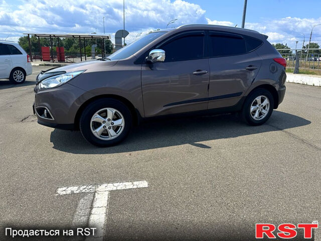 Коричневий Хендай іх35, об'ємом двигуна 1.7 л та пробігом 206 тис. км за 12600 $, фото 6 на Automoto.ua