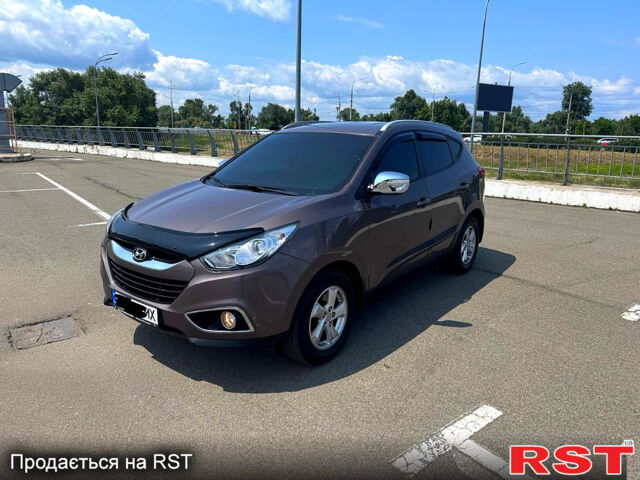Коричневий Хендай іх35, об'ємом двигуна 1.7 л та пробігом 206 тис. км за 12600 $, фото 5 на Automoto.ua
