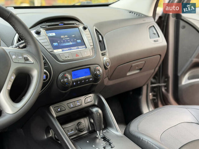 Коричневий Хендай іх35, об'ємом двигуна 2 л та пробігом 230 тис. км за 15300 $, фото 31 на Automoto.ua