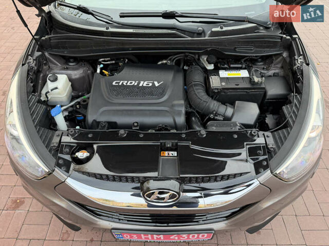 Коричневий Хендай іх35, об'ємом двигуна 2 л та пробігом 230 тис. км за 15300 $, фото 49 на Automoto.ua