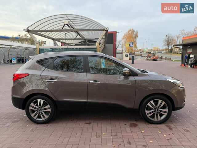 Коричневий Хендай іх35, об'ємом двигуна 2 л та пробігом 230 тис. км за 15300 $, фото 12 на Automoto.ua