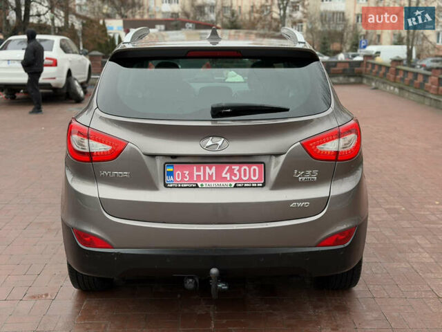 Коричневий Хендай іх35, об'ємом двигуна 2 л та пробігом 230 тис. км за 14300 $, фото 5 на Automoto.ua