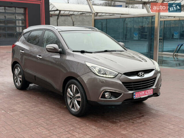 Коричневий Хендай іх35, об'ємом двигуна 2 л та пробігом 230 тис. км за 14300 $, фото 1 на Automoto.ua