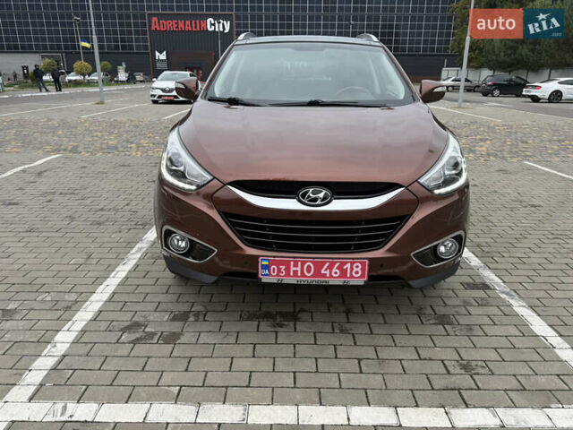 Коричневий Хендай іх35, об'ємом двигуна 2 л та пробігом 211 тис. км за 17400 $, фото 6 на Automoto.ua