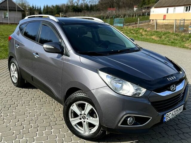 Сірий Хендай іх35, об'ємом двигуна 2.4 л та пробігом 220 тис. км за 11950 $, фото 1 на Automoto.ua