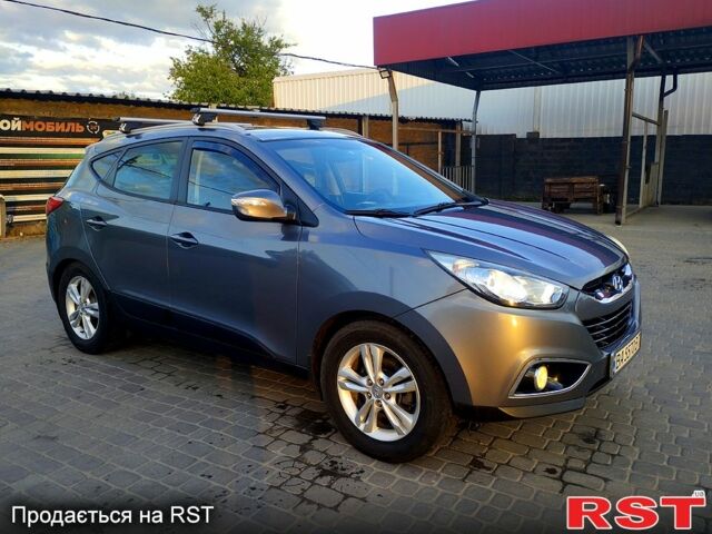 Сірий Хендай іх35, об'ємом двигуна 2 л та пробігом 230 тис. км за 11750 $, фото 4 на Automoto.ua