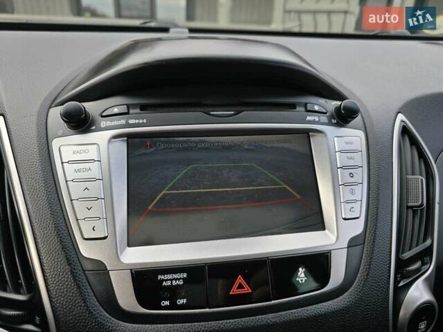 Сірий Хендай іх35, об'ємом двигуна 1.69 л та пробігом 308 тис. км за 11999 $, фото 18 на Automoto.ua