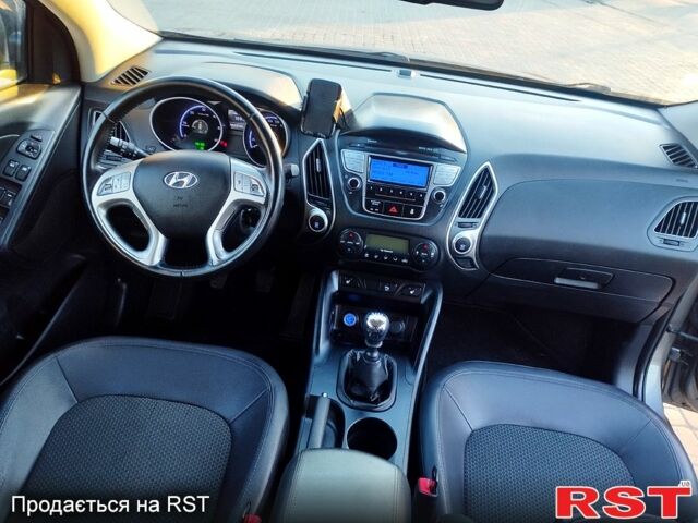 Сірий Хендай іх35, об'ємом двигуна 2 л та пробігом 230 тис. км за 11750 $, фото 8 на Automoto.ua