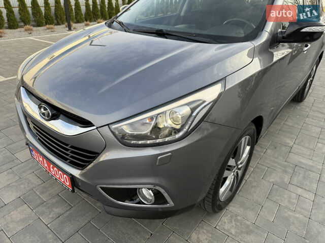 Сірий Хендай іх35, об'ємом двигуна 2 л та пробігом 124 тис. км за 16600 $, фото 13 на Automoto.ua