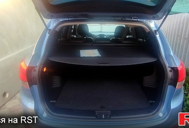 Синий Хендай их35, объемом двигателя 2 л и пробегом 140 тыс. км за 11500 $, фото 2 на Automoto.ua