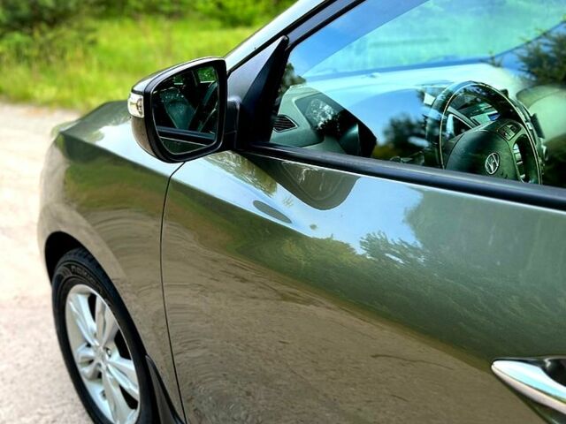 Зелений Хендай іх35, об'ємом двигуна 2 л та пробігом 115 тис. км за 11200 $, фото 7 на Automoto.ua