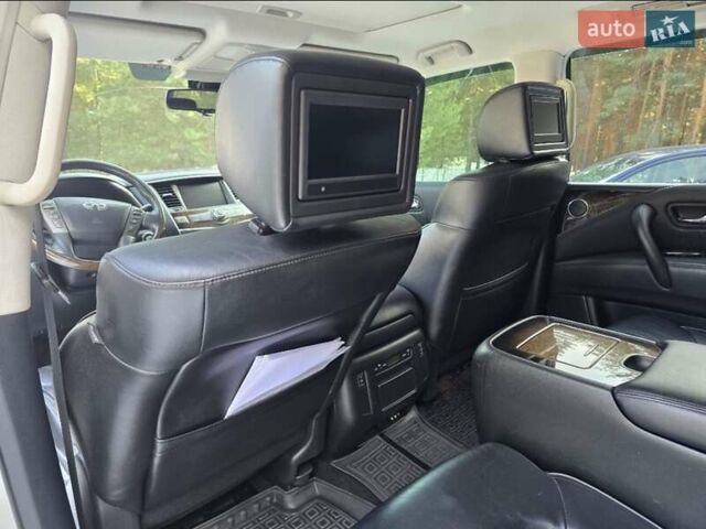 Белый Инфинити QX56, объемом двигателя 5.55 л и пробегом 127 тыс. км за 21000 $, фото 1 на Automoto.ua