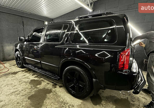 Чорний Інфініті QX56, об'ємом двигуна 5.6 л та пробігом 320 тис. км за 12500 $, фото 1 на Automoto.ua