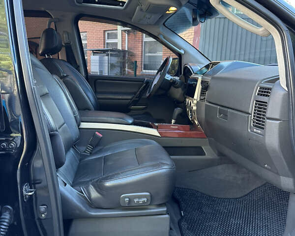 Черный Инфинити QX56, объемом двигателя 5.6 л и пробегом 250 тыс. км за 9890 $, фото 48 на Automoto.ua