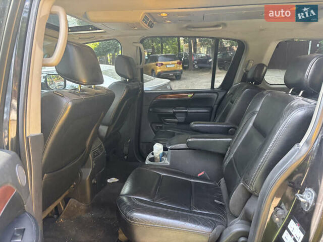 Черный Инфинити QX56, объемом двигателя 5.55 л и пробегом 450 тыс. км за 8000 $, фото 4 на Automoto.ua