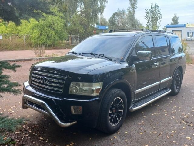 Черный Инфинити QX56, объемом двигателя 5 л и пробегом 233 тыс. км за 12000 $, фото 1 на Automoto.ua