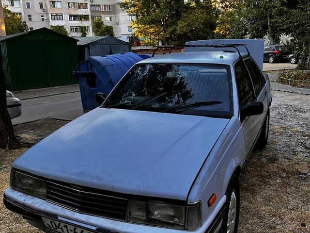 Серый Исузу Аска, объемом двигателя 2 л и пробегом 148 тыс. км за 600 $, фото 6 на Automoto.ua
