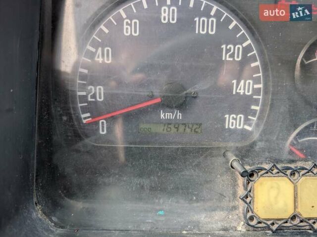 Белый Исузу НКР, объемом двигателя 4.57 л и пробегом 165 тыс. км за 8000 $, фото 1 на Automoto.ua