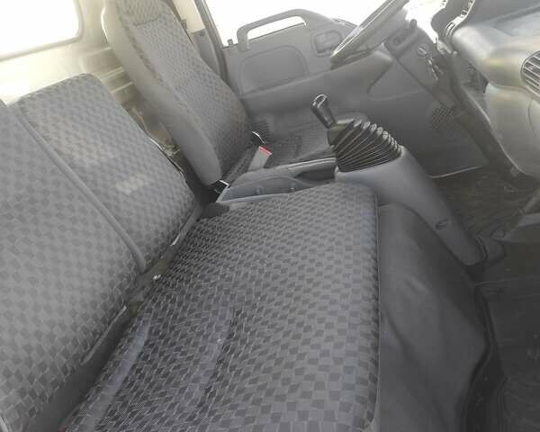 Белый Исузу НКР, объемом двигателя 4.57 л и пробегом 800 тыс. км за 16600 $, фото 4 на Automoto.ua