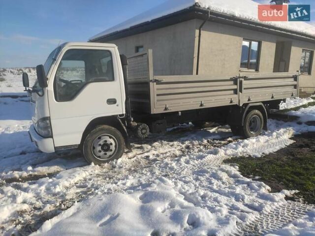 Белый Исузу НКР, объемом двигателя 4.57 л и пробегом 800 тыс. км за 16600 $, фото 2 на Automoto.ua