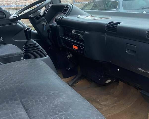 Синий Исузу НКР, объемом двигателя 5.2 л и пробегом 944 тыс. км за 7000 $, фото 7 на Automoto.ua