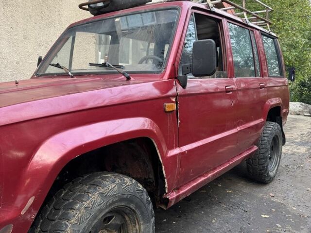 Червоний Ісузу Trooper, об'ємом двигуна 2.5 л та пробігом 200 тис. км за 1700 $, фото 1 на Automoto.ua