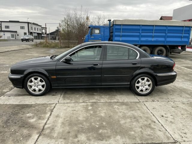 Черный Ягуар Х-Тайп, объемом двигателя 2.5 л и пробегом 142 тыс. км за 4200 $, фото 6 на Automoto.ua