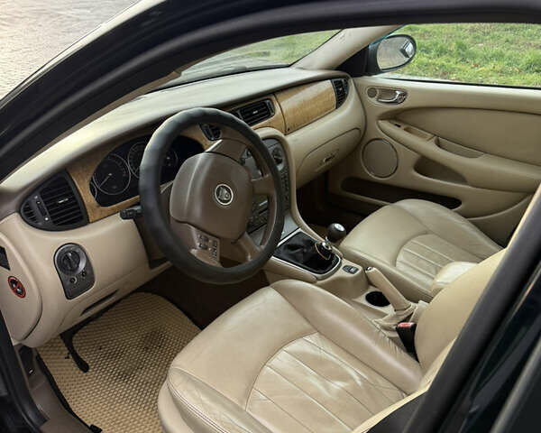 Черный Ягуар Х-Тайп, объемом двигателя 2 л и пробегом 335 тыс. км за 5400 $, фото 10 на Automoto.ua