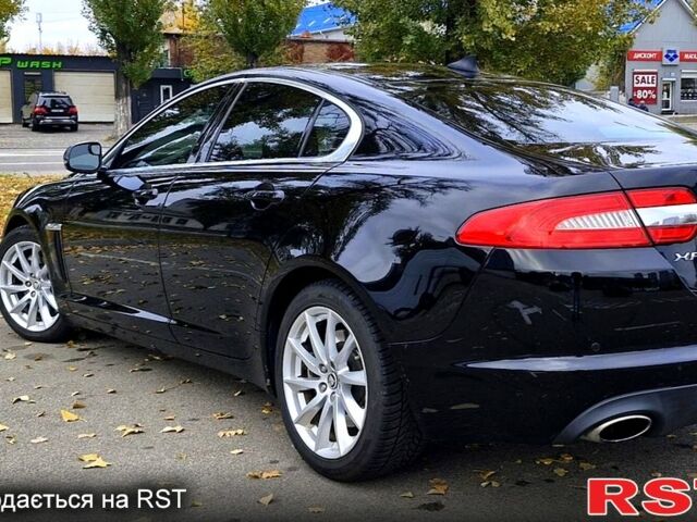 Черный Ягуар ХФ, объемом двигателя 2 л и пробегом 129 тыс. км за 16200 $, фото 1 на Automoto.ua