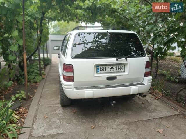 Білий Джип Cherokee, об'ємом двигуна 4 л та пробігом 200 тис. км за 5300 $, фото 7 на Automoto.ua
