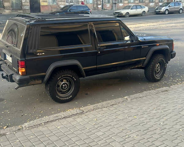 Черный Джип Чероки, объемом двигателя 2.1 л и пробегом 100 тыс. км за 12000 $, фото 4 на Automoto.ua