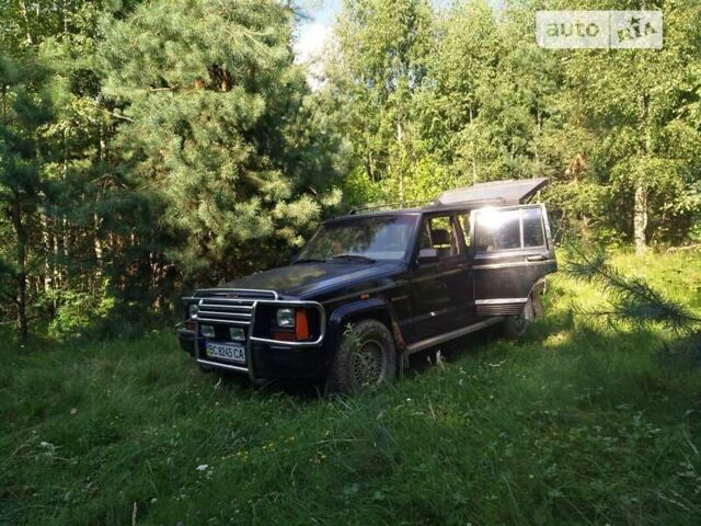 Чорний Джип Cherokee, об'ємом двигуна 4 л та пробігом 322 тис. км за 5800 $, фото 4 на Automoto.ua