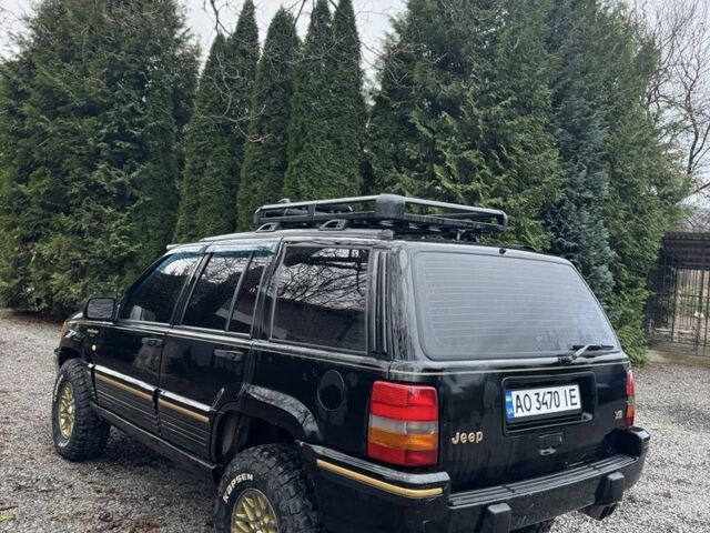 Чорний Джип Cherokee, об'ємом двигуна 5.2 л та пробігом 340 тис. км за 6300 $, фото 2 на Automoto.ua