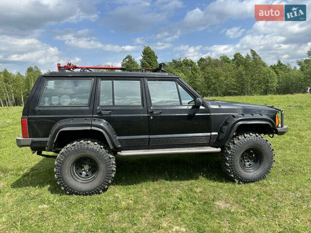 Чорний Джип Cherokee, об'ємом двигуна 4 л та пробігом 370 тис. км за 11500 $, фото 5 на Automoto.ua