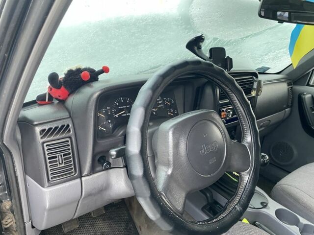 Черный Джип Чероки, объемом двигателя 2.5 л и пробегом 230 тыс. км за 6700 $, фото 5 на Automoto.ua