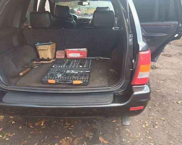 Чорний Джип Cherokee, об'ємом двигуна 3.1 л та пробігом 333 тис. км за 8500 $, фото 2 на Automoto.ua