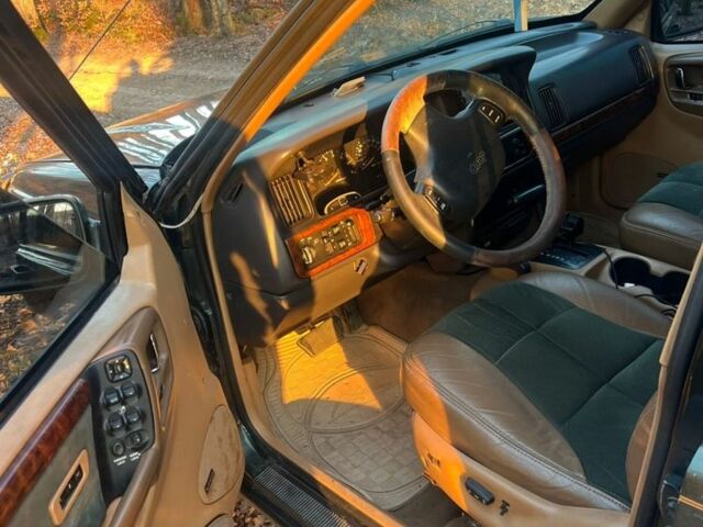 Зелений Джип Cherokee, об'ємом двигуна 5.2 л та пробігом 326 тис. км за 6000 $, фото 4 на Automoto.ua
