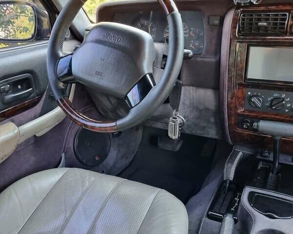 Зелений Джип Cherokee, об'ємом двигуна 4 л та пробігом 370 тис. км за 6700 $, фото 6 на Automoto.ua