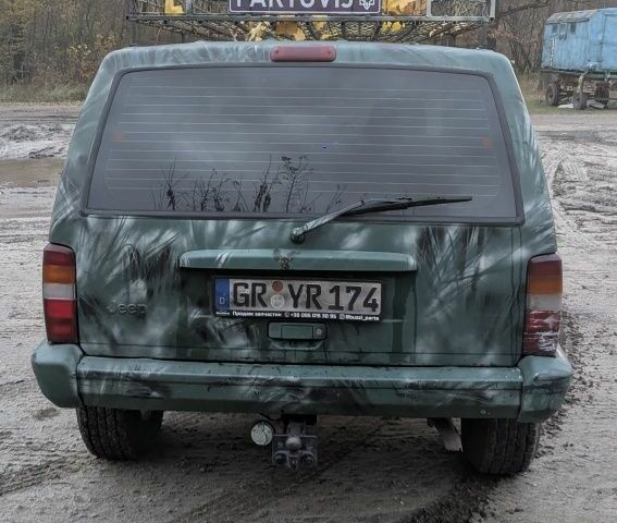 Зеленый Джип Чероки, объемом двигателя 2.5 л и пробегом 308 тыс. км за 3000 $, фото 3 на Automoto.ua