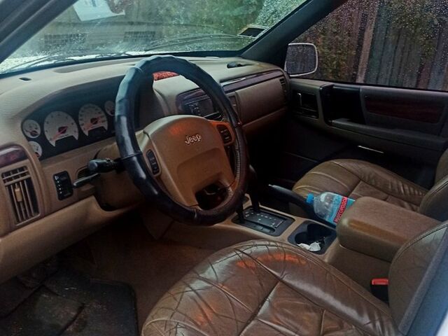 Білий Джип Grand Cherokee, об'ємом двигуна 4 л та пробігом 400 тис. км за 4500 $, фото 3 на Automoto.ua