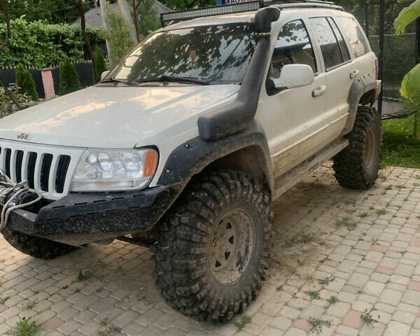 Білий Джип Grand Cherokee, об'ємом двигуна 4.7 л та пробігом 245 тис. км за 12500 $, фото 6 на Automoto.ua