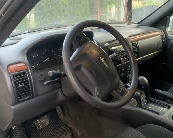 Білий Джип Grand Cherokee, об'ємом двигуна 4.7 л та пробігом 245 тис. км за 12500 $, фото 4 на Automoto.ua