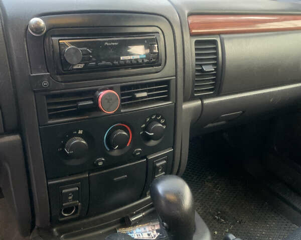 Білий Джип Grand Cherokee, об'ємом двигуна 4.7 л та пробігом 245 тис. км за 12500 $, фото 3 на Automoto.ua